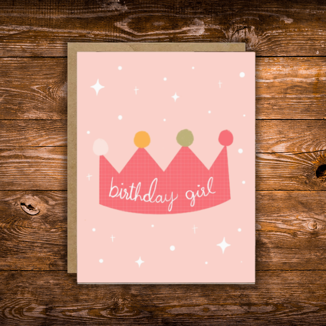 Cute birthday greeting card featuring a pink illustrated crown with the words "Birthday Girl" on a soft blush pink background with scattered stars.