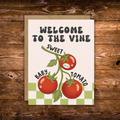 Greeting card featuring three tomatoes on the vine with the playful message "Welcome to the Vine, Sweet Baby Tomato," perfect for celebrating a new baby.