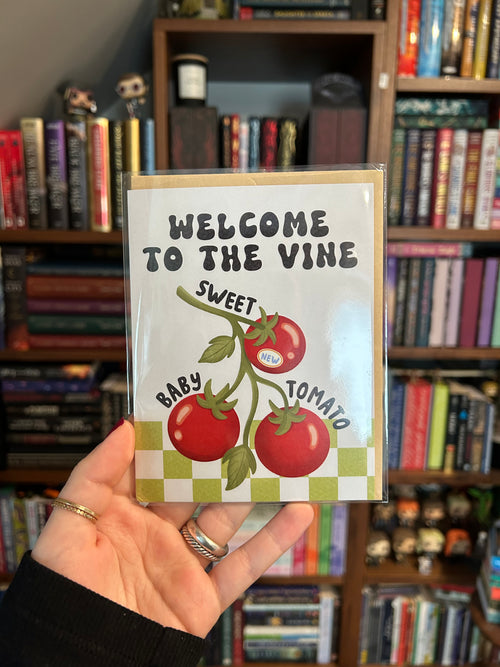 Greeting card featuring three tomatoes on the vine with the playful message "Welcome to the Vine, Sweet Baby Tomato," perfect for celebrating a new baby.