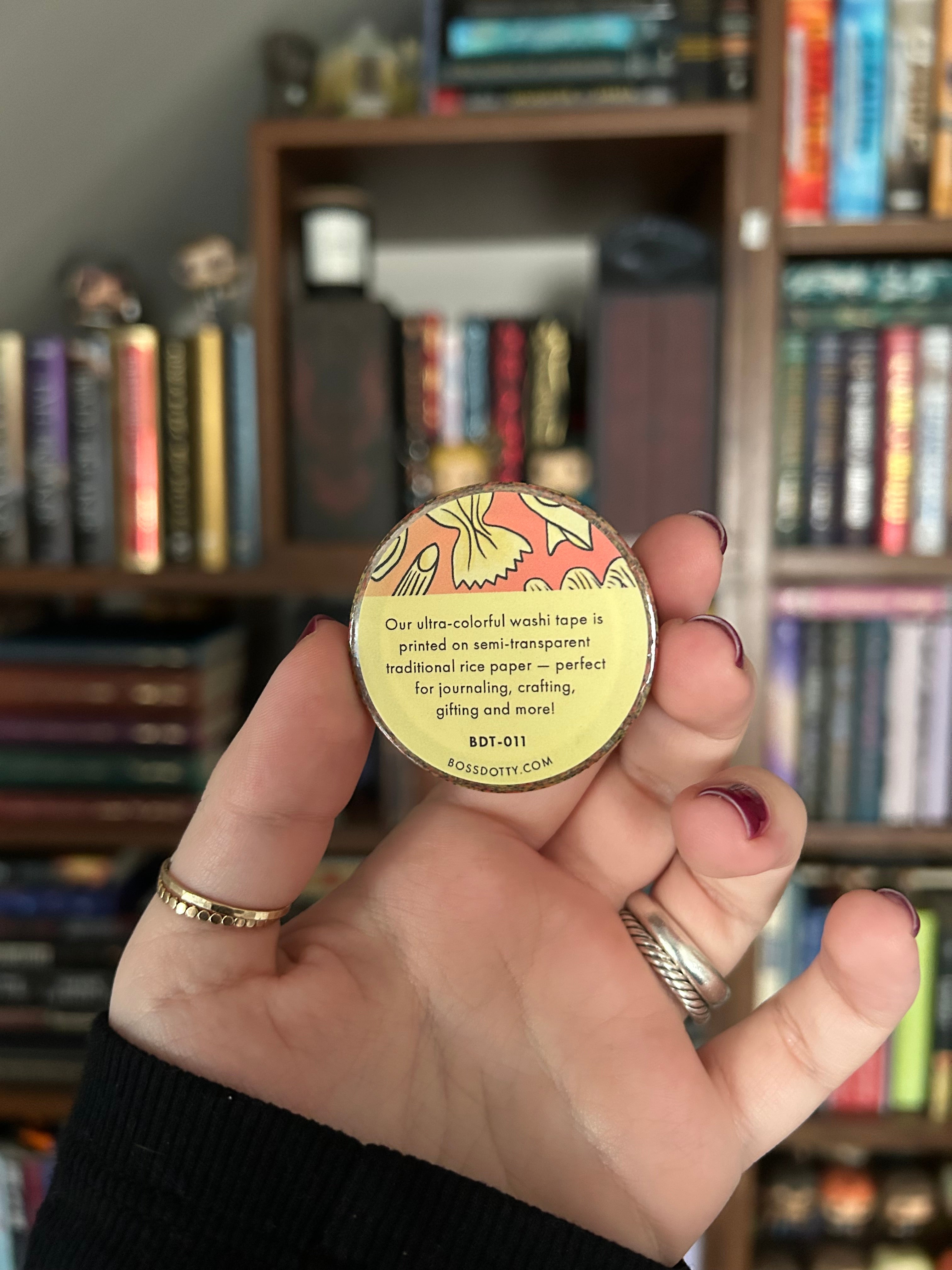 Decorative washi tape featuring illustrated pasta shapes including ravioli, rigatoni, fusilli, shells, and farfalle on a red background.
Boss Dotty