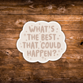 A die-cut sticker with the phrase 'WHAT'S THE BEST THAT COULD HAPPEN?' in a dusty cream font on a cream background, surrounded by small cream stars, shown on a rustic brown wooden plank surface.