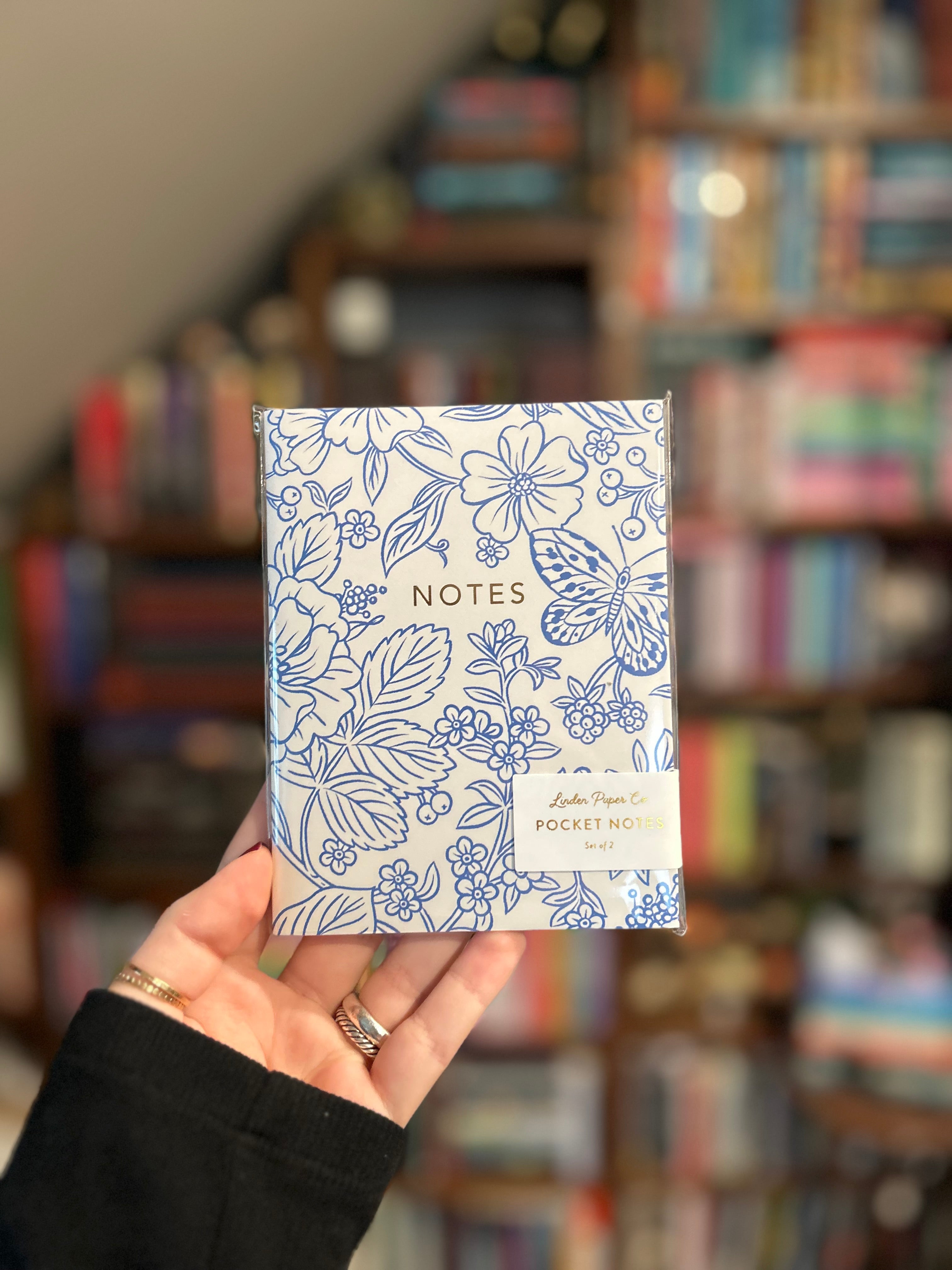 Blue floral notebook featuring coordinating floral cover designs with gold foil details, 44 blank pages, and saddle stitched binding.