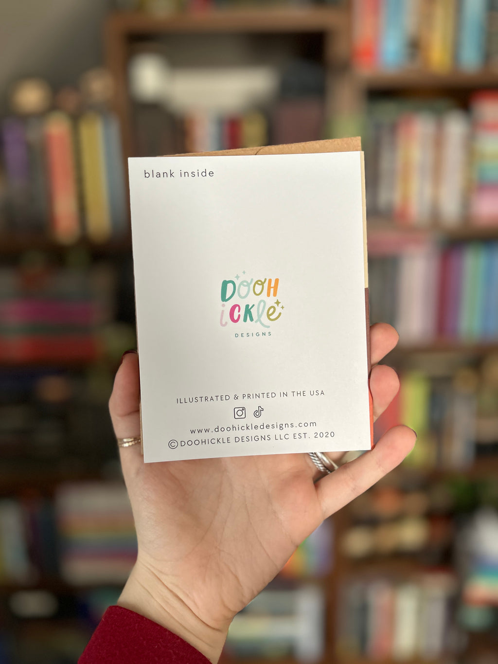Back of modern greeting card featuring printer information: Doohickle Designs. Printed in USA