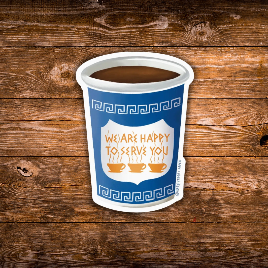 A die-cut sticker shaped like a paper coffee cup, featuring a blue and white design with the text 'WE ARE HAPPY TO SERVE YOU' and three coffee cup icons. The sticker is shown against a rustic brown wooden plank background.