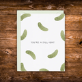 Greeting card featuring a watercolor pickle pattern with the phrase "You're a Dill-ight."