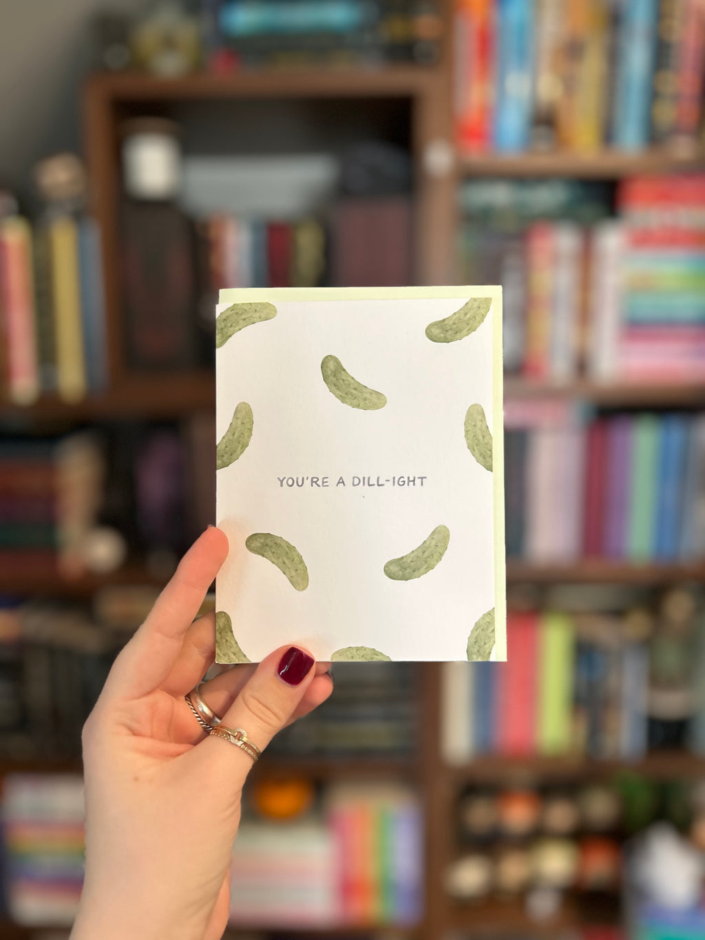 Greeting card featuring a watercolor pickle pattern with the phrase "You're a Dill-ight."