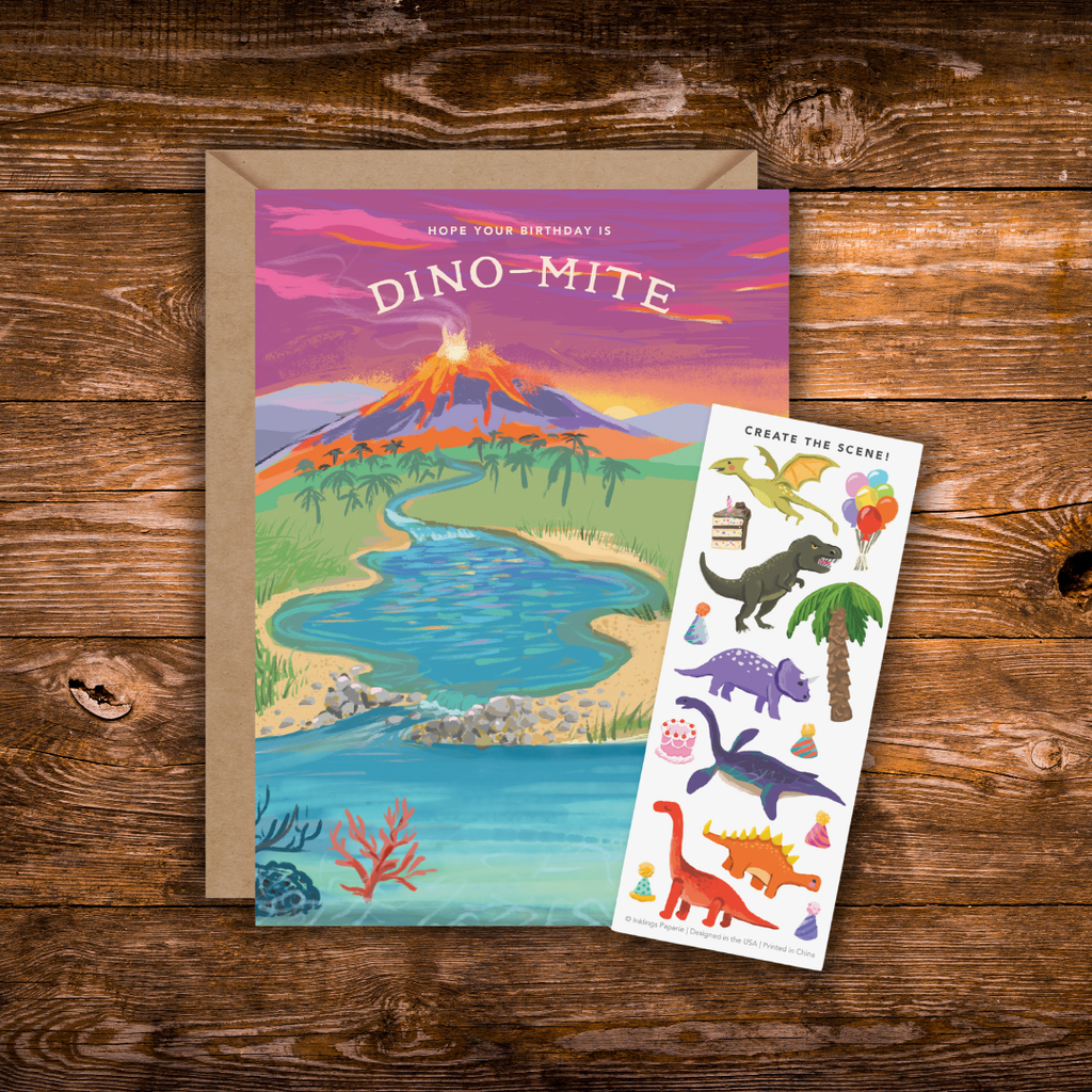 Interactive dinosaur birthday greeting card featuring a prehistoric landscape with an erupting volcano, river, and the message "Hope Your Birthday is Dino-Mite," plus a matching dinosaur-themed sticker sheet.