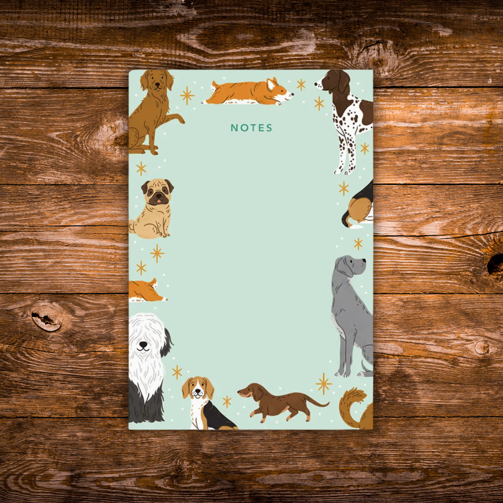 Tear-away notepad featuring illustrated dogs of various breeds around the border with an open center for writing notes.