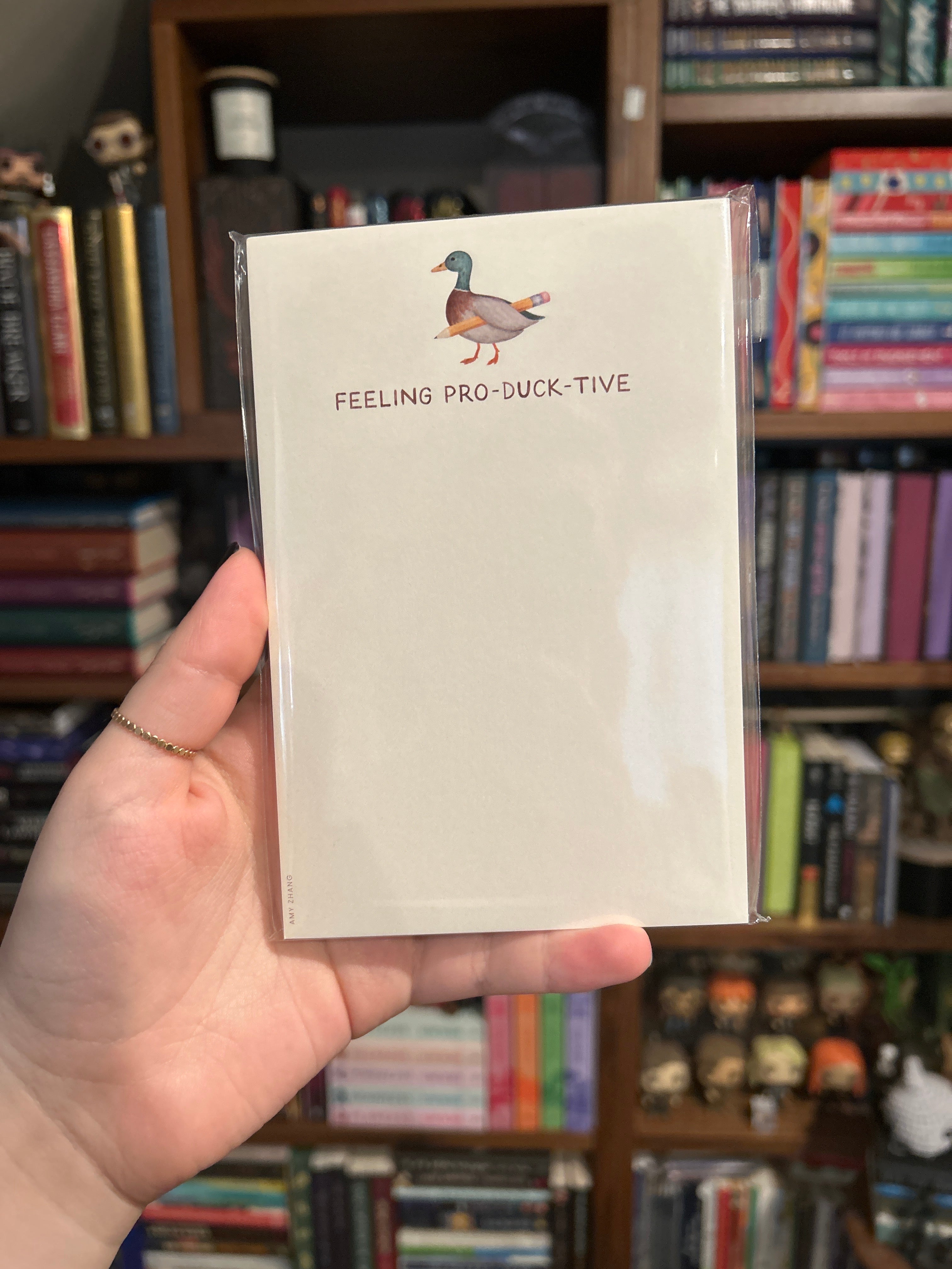 Duck-themed tear-away notepad featuring an illustrated duck holding a pencil and the phrase "Feeling Pro-Duck-Tive."