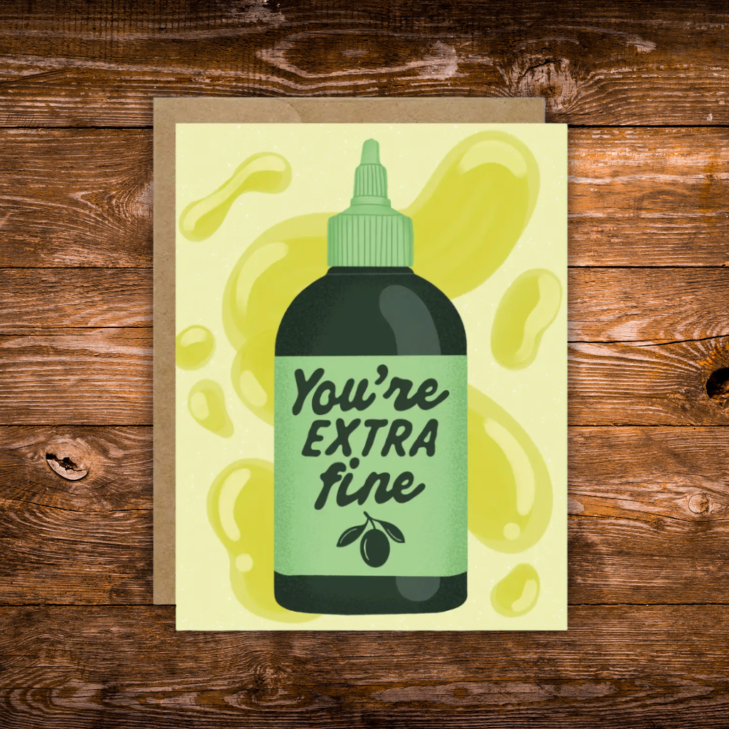 Funny greeting card featuring an olive oil bottle with the phrase "You're Extra Fine" on a light yellow background with olive oil splashes.