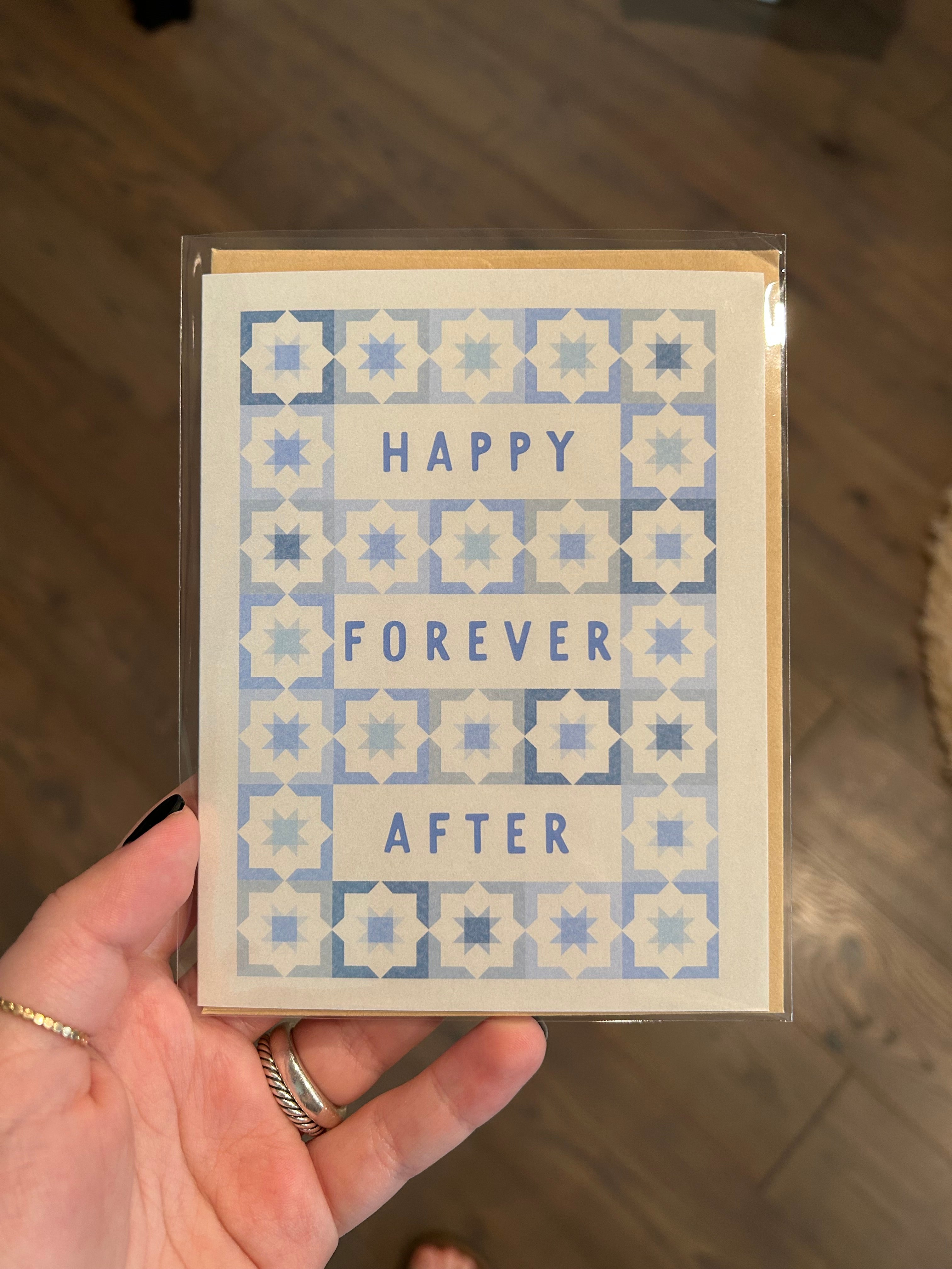 Modern wedding greeting card featuring the words "Happy Forever After" surrounded by a blue geometric tile pattern on a white background.