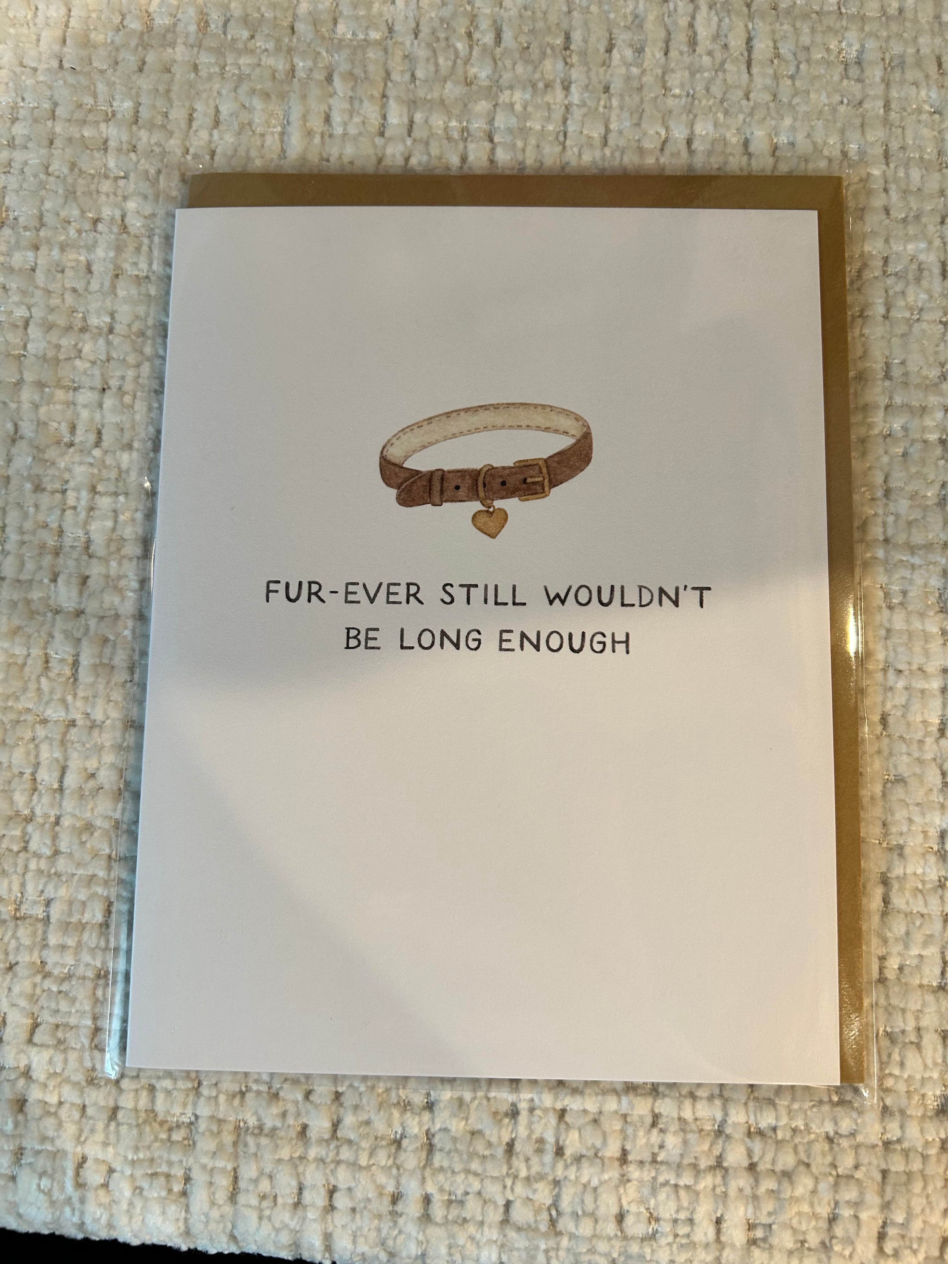 Minimalist pet sympathy greeting card featuring a brown pet collar with a heart-shaped tag and the message "Fur-Ever Still Wouldn't Be Long Enough" on a white background.