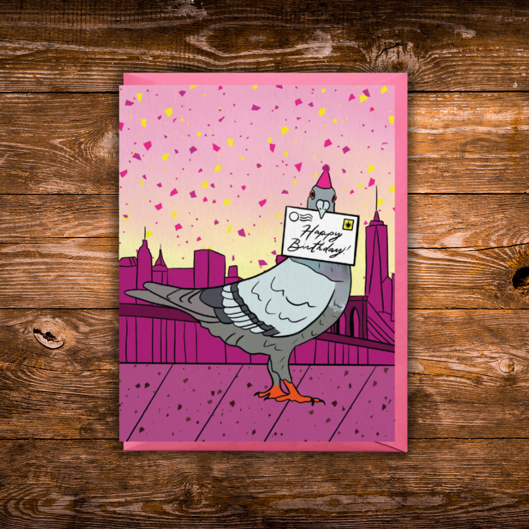Birthday greeting card featuring a pigeon wearing a party hat and delivering a Happy Birthday letter with the New York City skyline in the background.