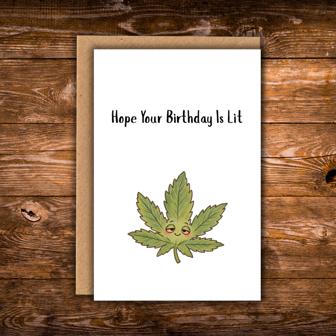 Funny birthday greeting card featuring a sleepy illustrated green cannabis leaf beneath the words “Hope Your Birthday Is Lit,” with a plain white background and kraft envelope.