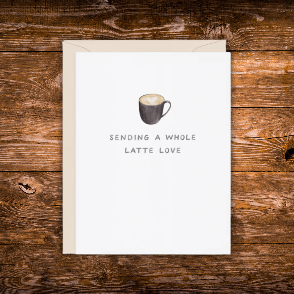 Minimalist greeting card featuring a latte with heart latte art and the phrase "Sending a Whole Latte Love."