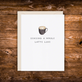 Minimalist greeting card featuring a latte with heart latte art and the phrase "Sending a Whole Latte Love."