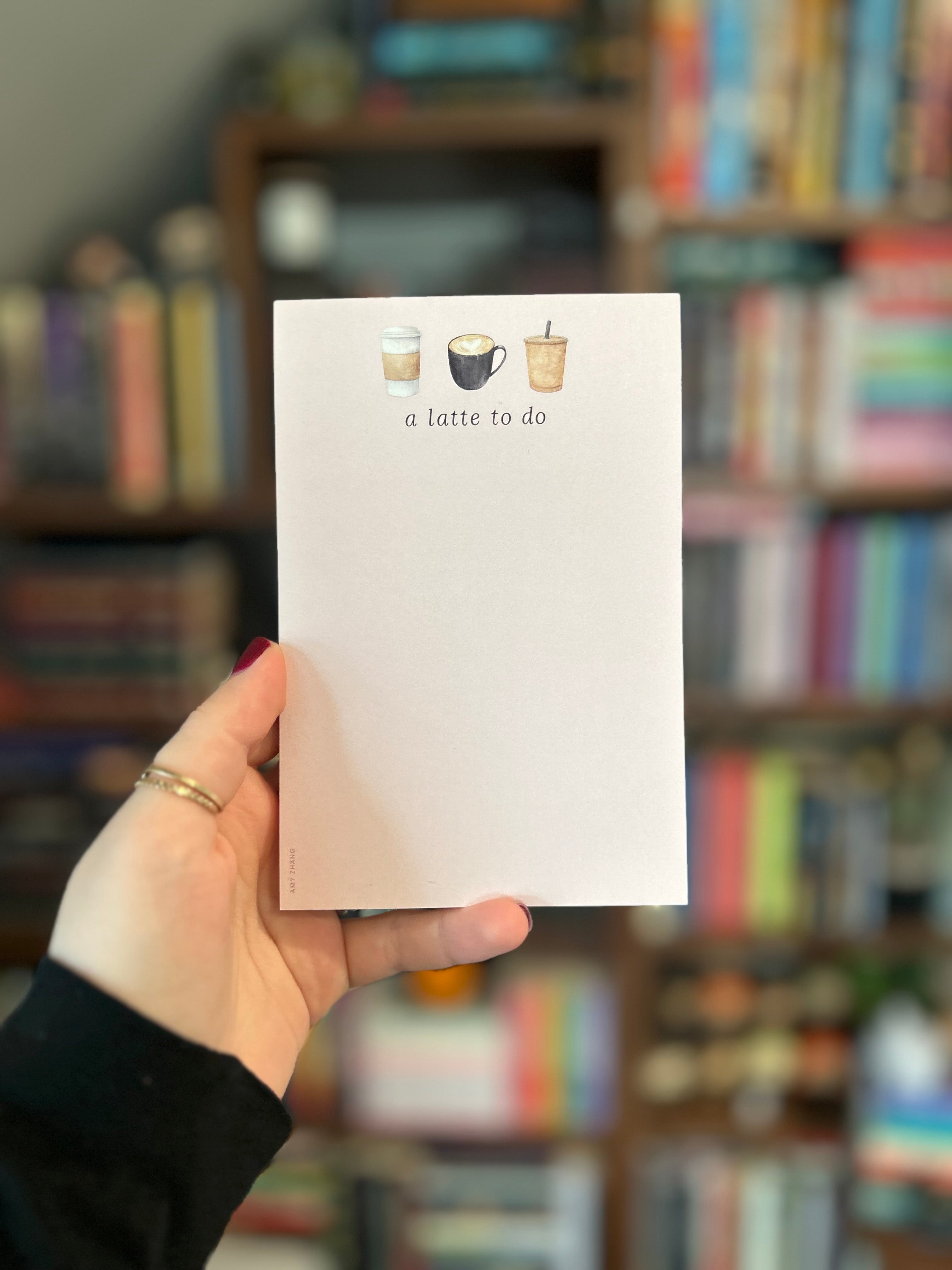 Coffee-themed tear-away notepad featuring three illustrated coffee drinks and the phrase "A Latte To Do."