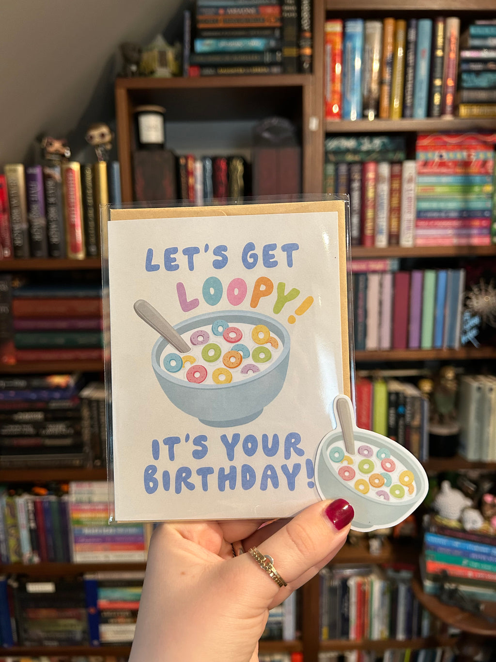 Birthday bundle featuring a colorful cereal-themed greeting card paired with a matching waterproof cereal bowl vinyl sticker