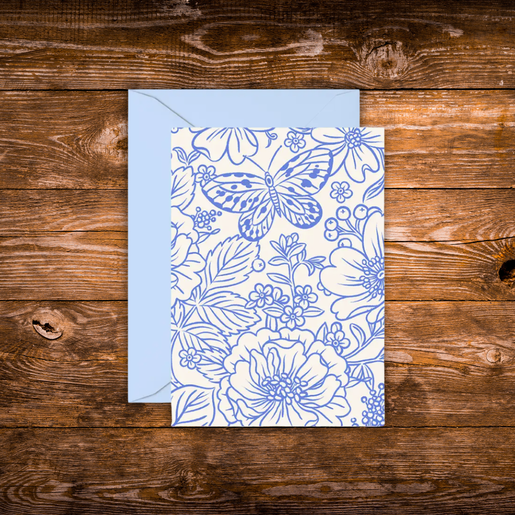 Mini greeting card featuring an elegant blue botanical illustration with flowers and a butterfly on a white background.
