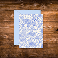 Mini greeting card featuring an elegant blue botanical illustration with flowers and a butterfly on a white background.