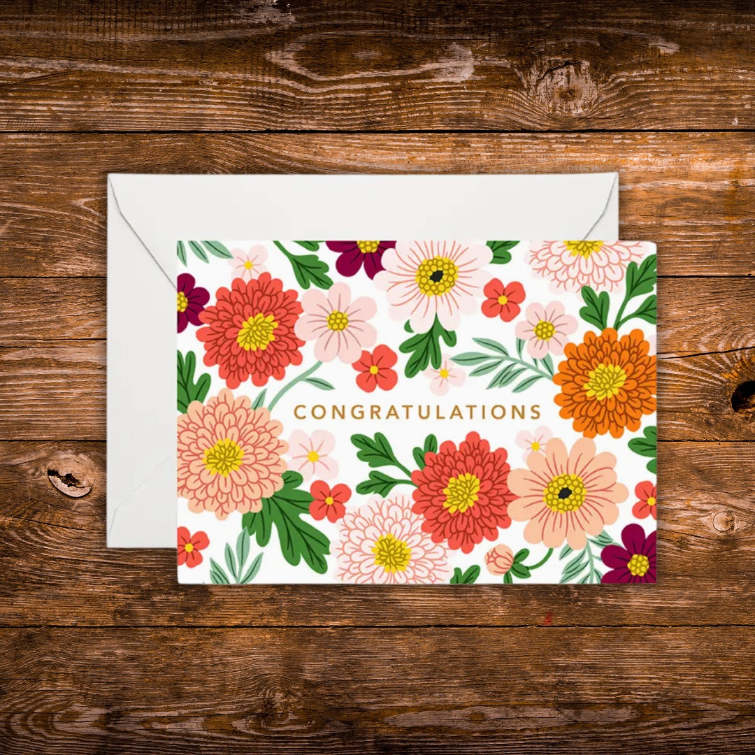 Mini landscape greeting card featuring colorful flowers surrounding the word "Congratulations" on a white background.
