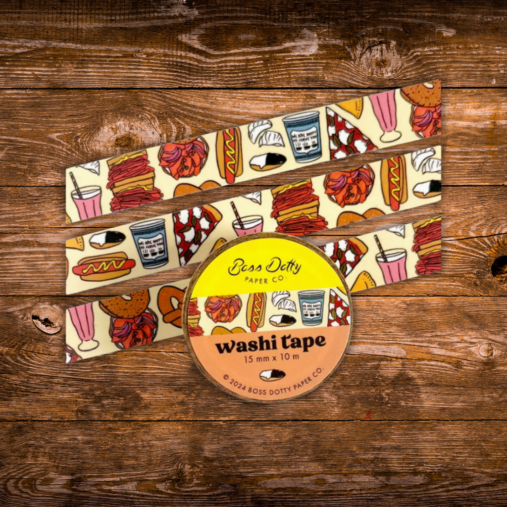 Decorative washi tape featuring illustrations of iconic New York foods including pizza, bagels, hot dogs, coffee, pretzels, and deli favorites.