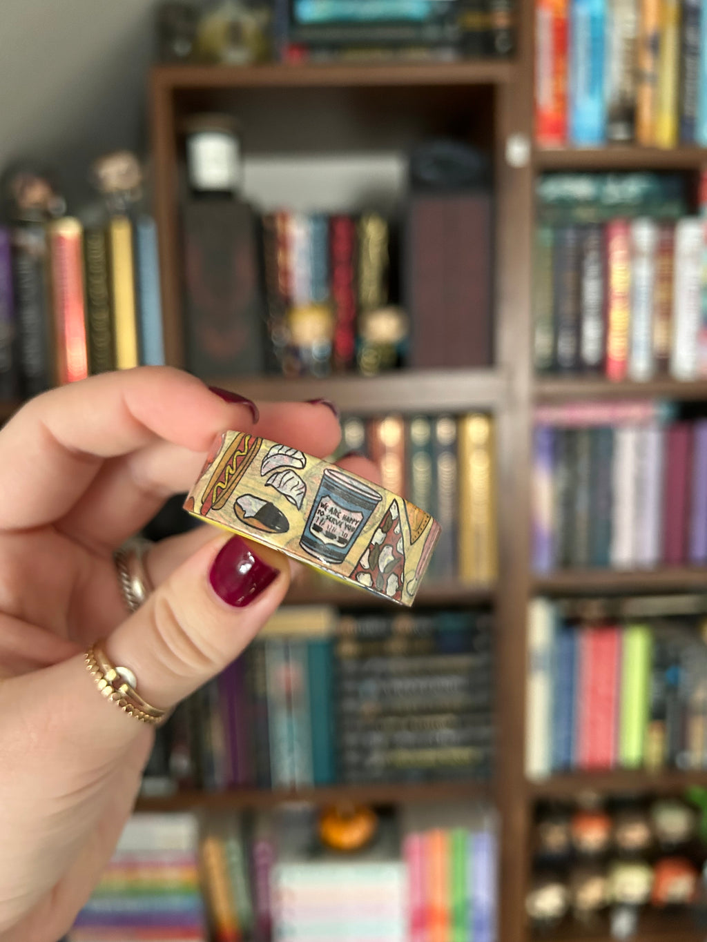 Decorative washi tape featuring illustrations of iconic New York foods including pizza, bagels, hot dogs, coffee, pretzels, and deli favorites.