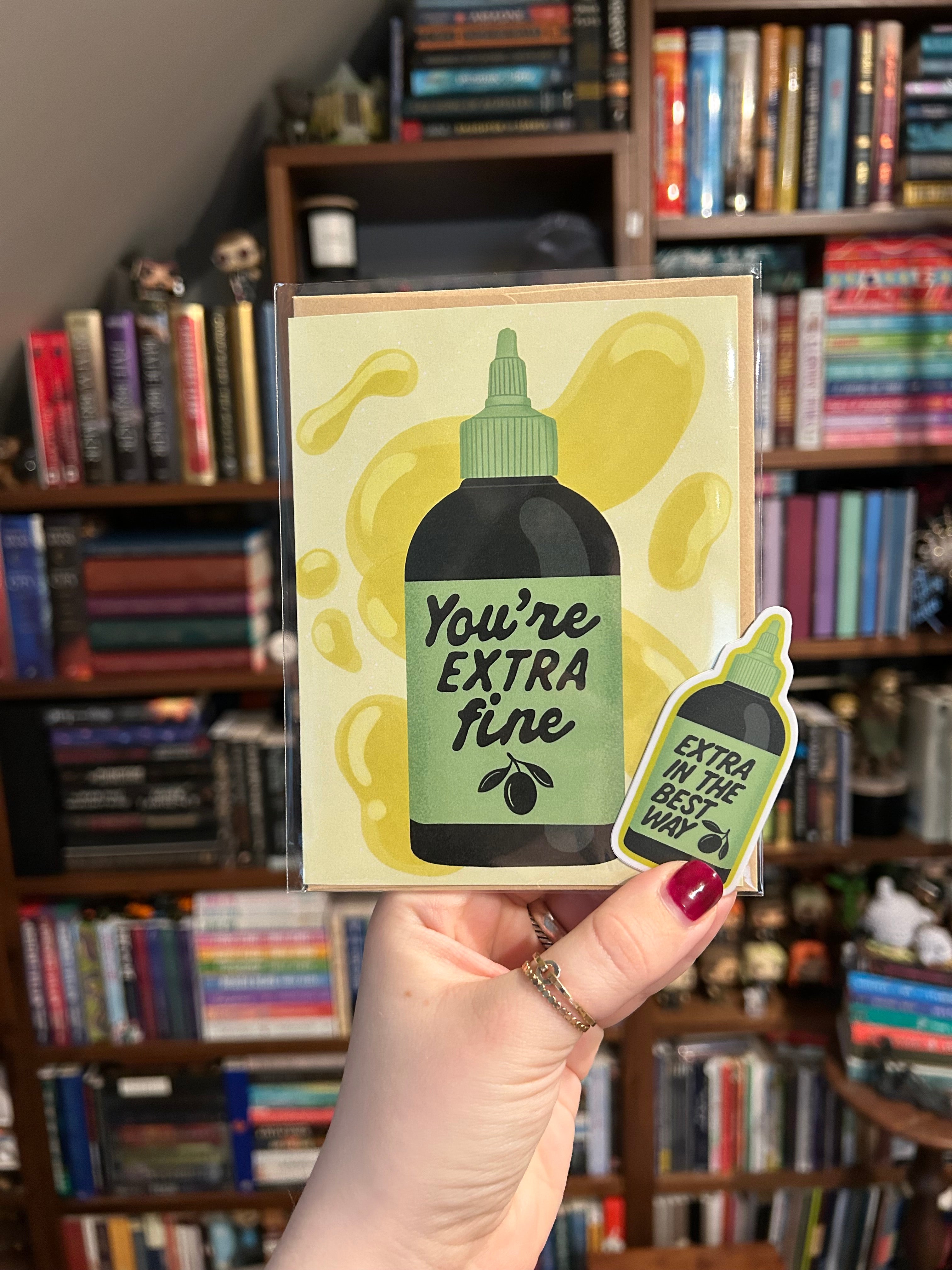 Matching gift set featuring a "You're Extra Fine" olive oil greeting card paired with a coordinating "Extra In The Best Way" waterproof vinyl sticker.