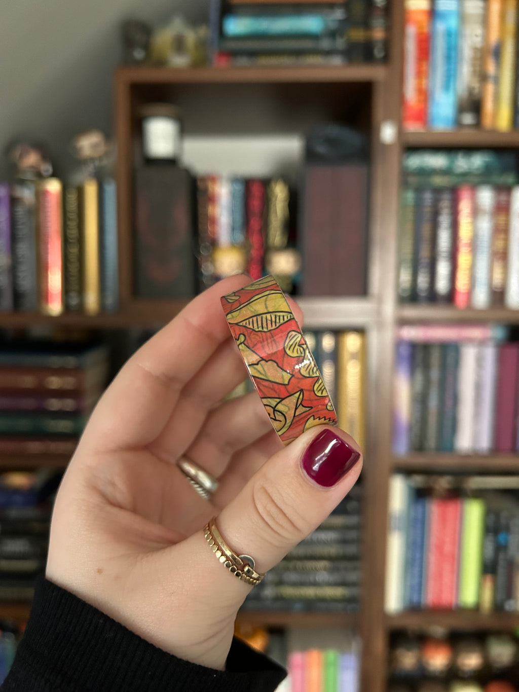 Decorative washi tape featuring illustrated pasta shapes including ravioli, rigatoni, fusilli, shells, and farfalle on a red background.