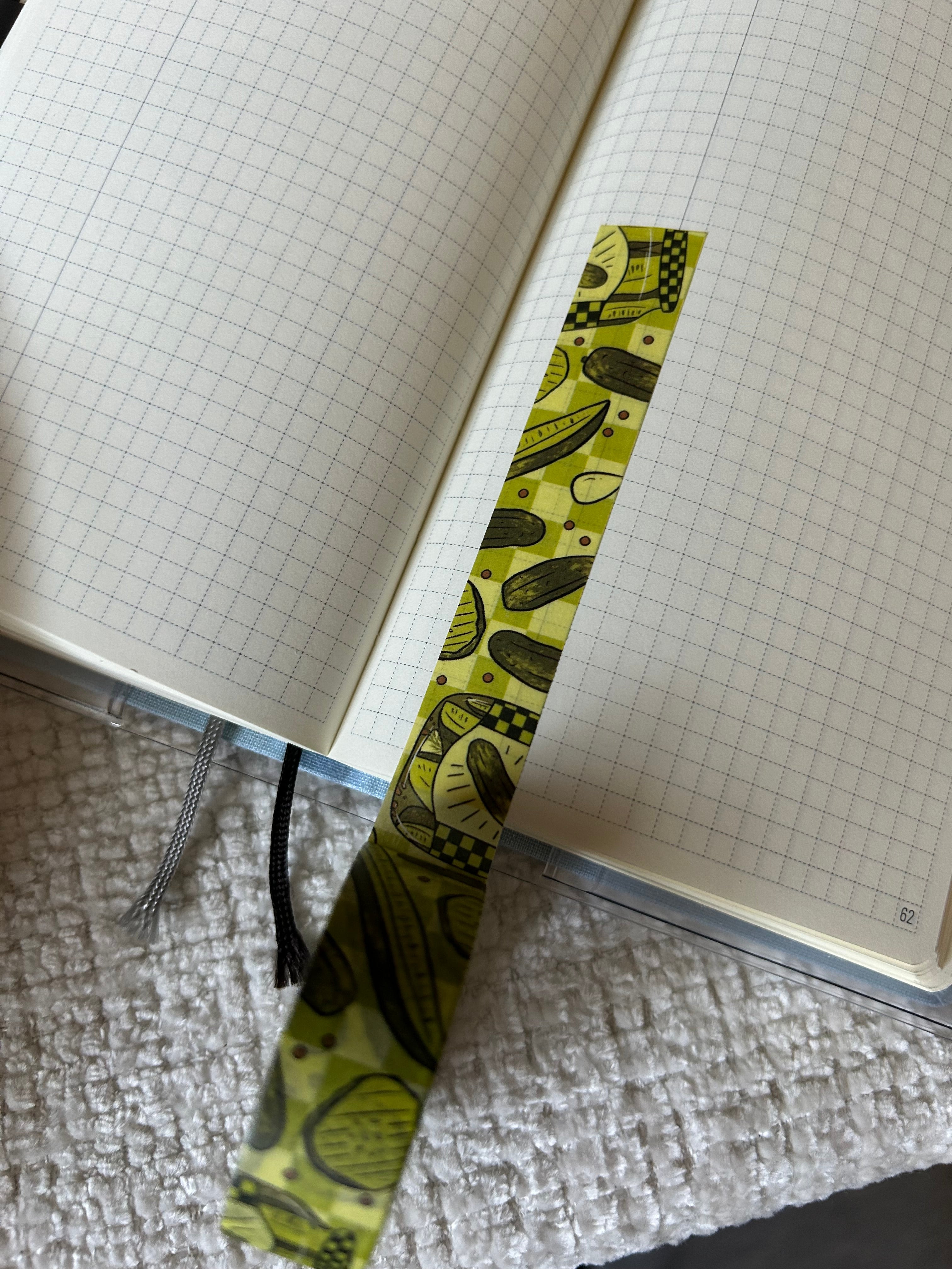 Decorative washi tape featuring illustrated pickle jars, pickle slices, whole pickles, and a green picnic-inspired pattern.