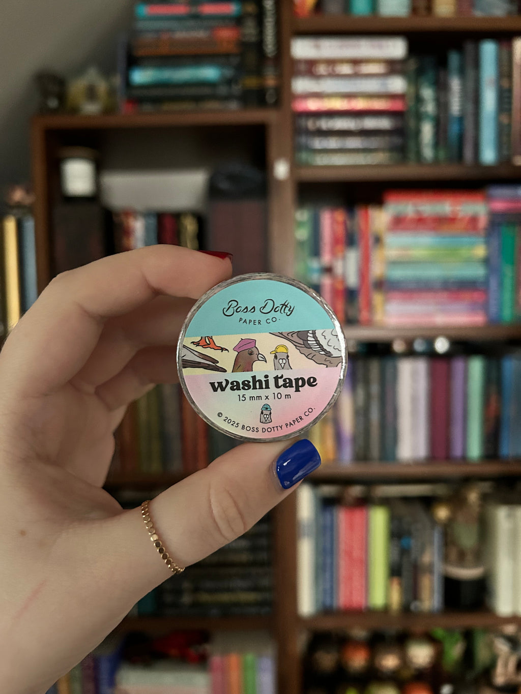 Decorative washi tape featuring whimsical New York City pigeons wearing colorful hats and accessories on pastel backgrounds.