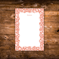Floral notepad featuring a coral-red background with a delicate white flower border and a scalloped writing area labeled "Notes."