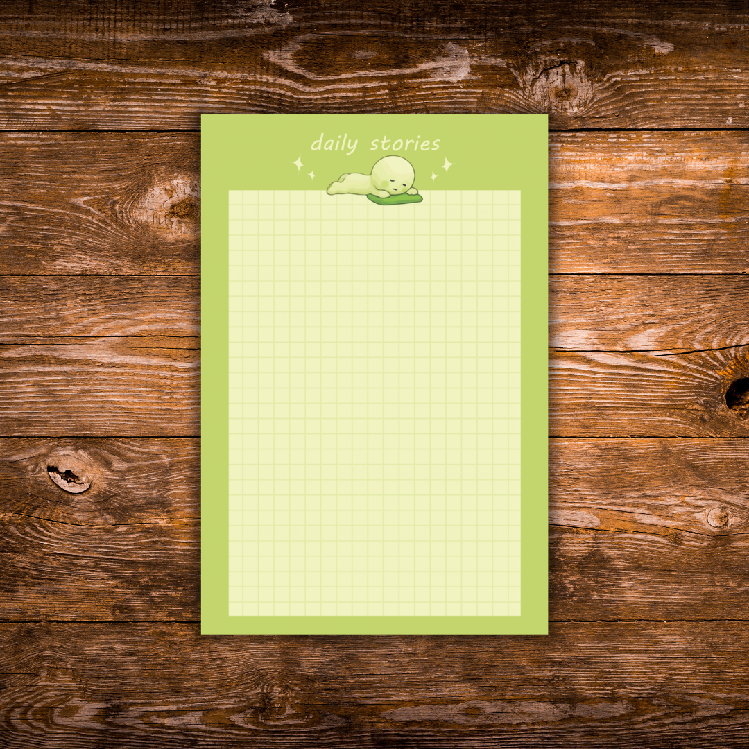 Green Smiski-inspired notepad with a cute lounging character and light grid writing paper