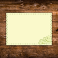 5 x 7 pastel yellow-green notepad featuring a sleepy green character lounging beside a small cat in the bottom-right corner, framed by a green dotted border.