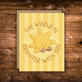 Cute encouragement greeting card featuring a smiling sunshine with the message "The World Is Brighter With You" on a soft yellow striped background.