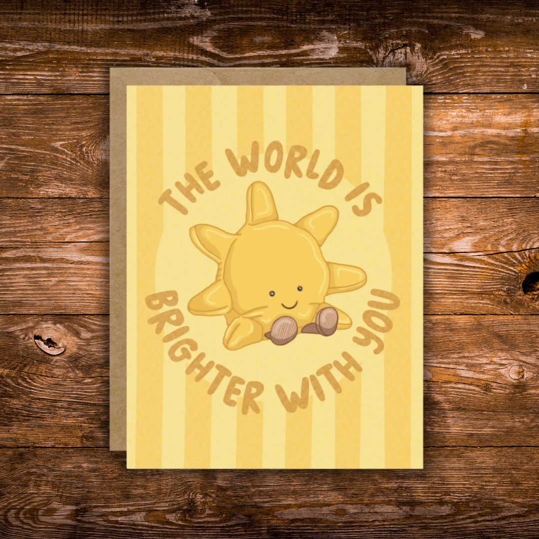 Cute encouragement greeting card featuring a smiling sunshine with the message "The World Is Brighter With You" on a soft yellow striped background.