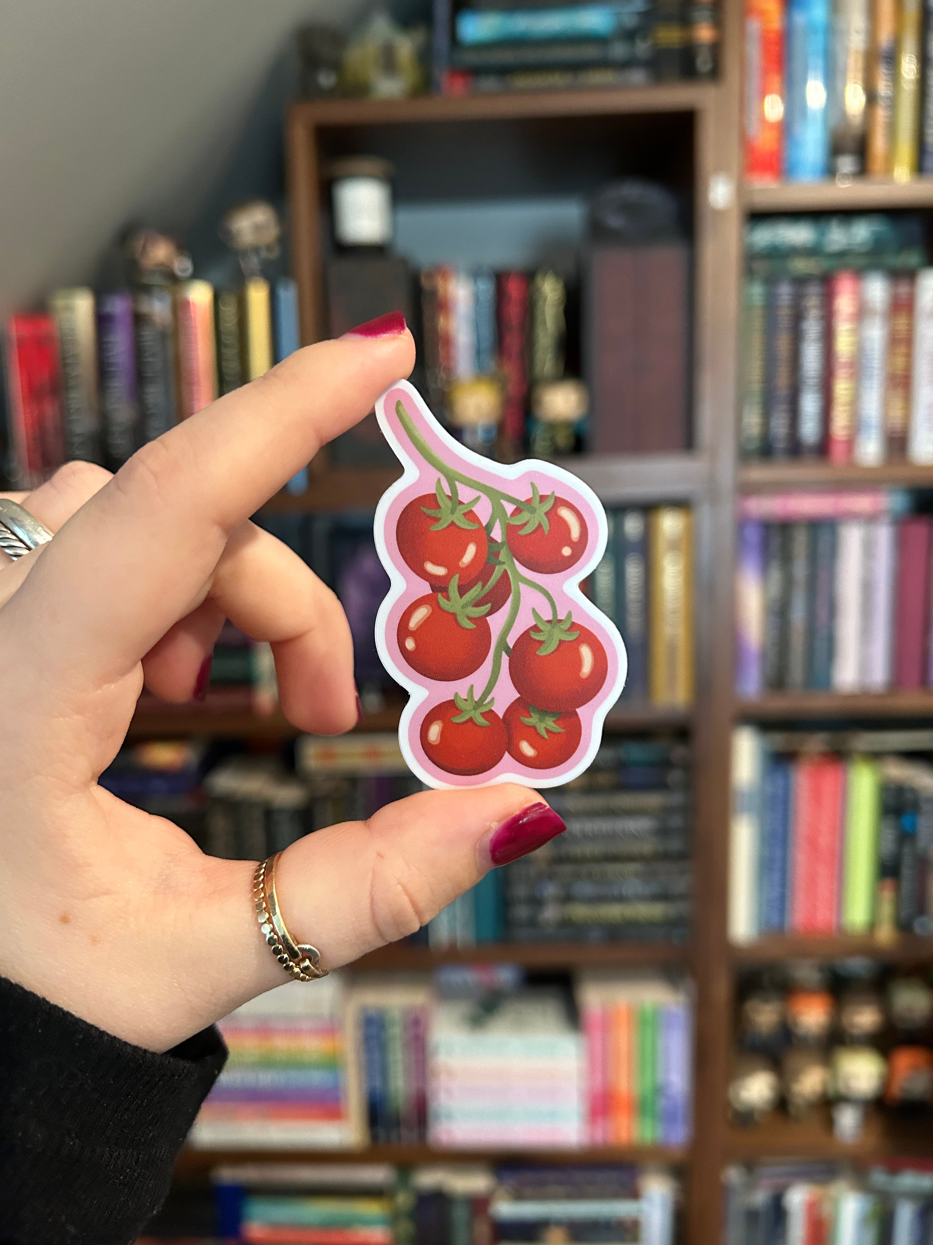 Tomato vine waterproof vinyl sticker with red cherry tomatoes on a pink background