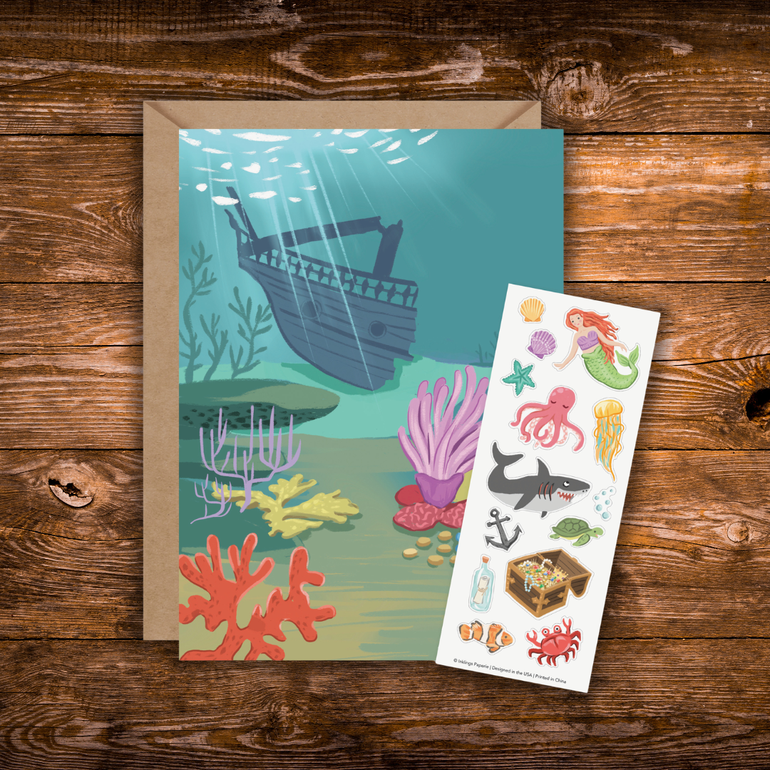Interactive Under the Sea greeting card featuring an underwater shipwreck scene with a coordinating sticker sheet filled with mermaids, sea creatures, coral, treasure, and ocean accessories.