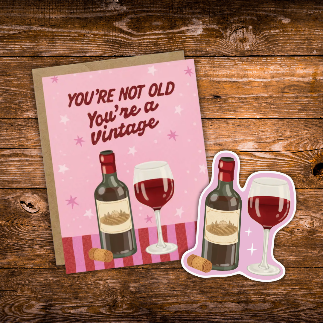 Matching gift set featuring a "You're Not Old, You're a Vintage" wine birthday greeting card paired with a coordinating waterproof vinyl wine sticker.