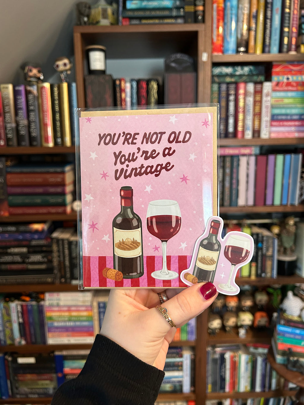 Matching gift set featuring a "You're Not Old, You're a Vintage" wine birthday greeting card paired with a coordinating waterproof vinyl wine sticker.