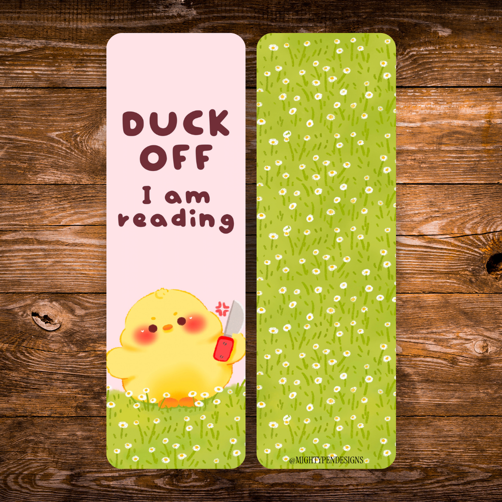 Double-sided yellow duck bookmark with the phrase “Duck off, I am reading” on a pink background, featuring a cute yellow duck holding a tiny knife and a green daisy pattern on the reverse.