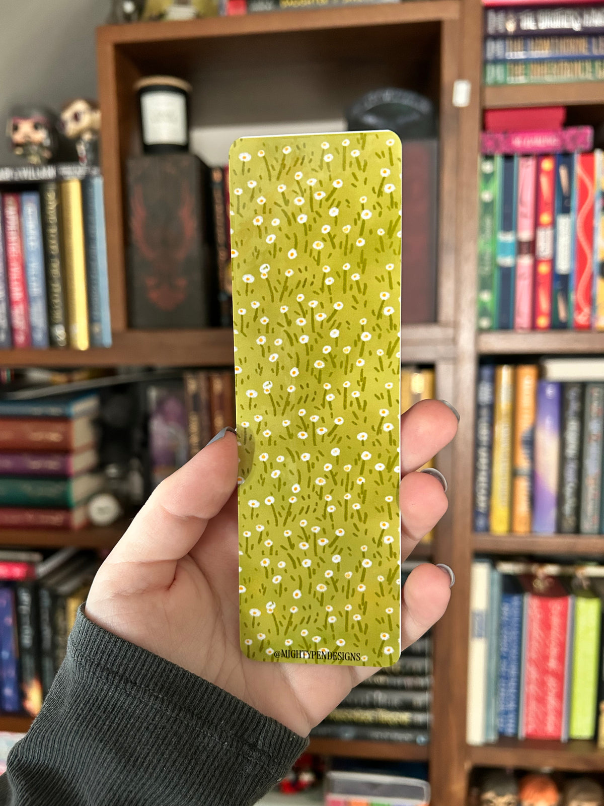 Double-sided yellow duck bookmark with the phrase “Duck off, I am reading” on a pink background, featuring a cute yellow duck holding a tiny knife and a green daisy pattern on the reverse.
